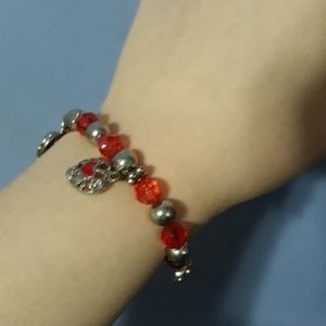 Red plastic beads with silver pieces
